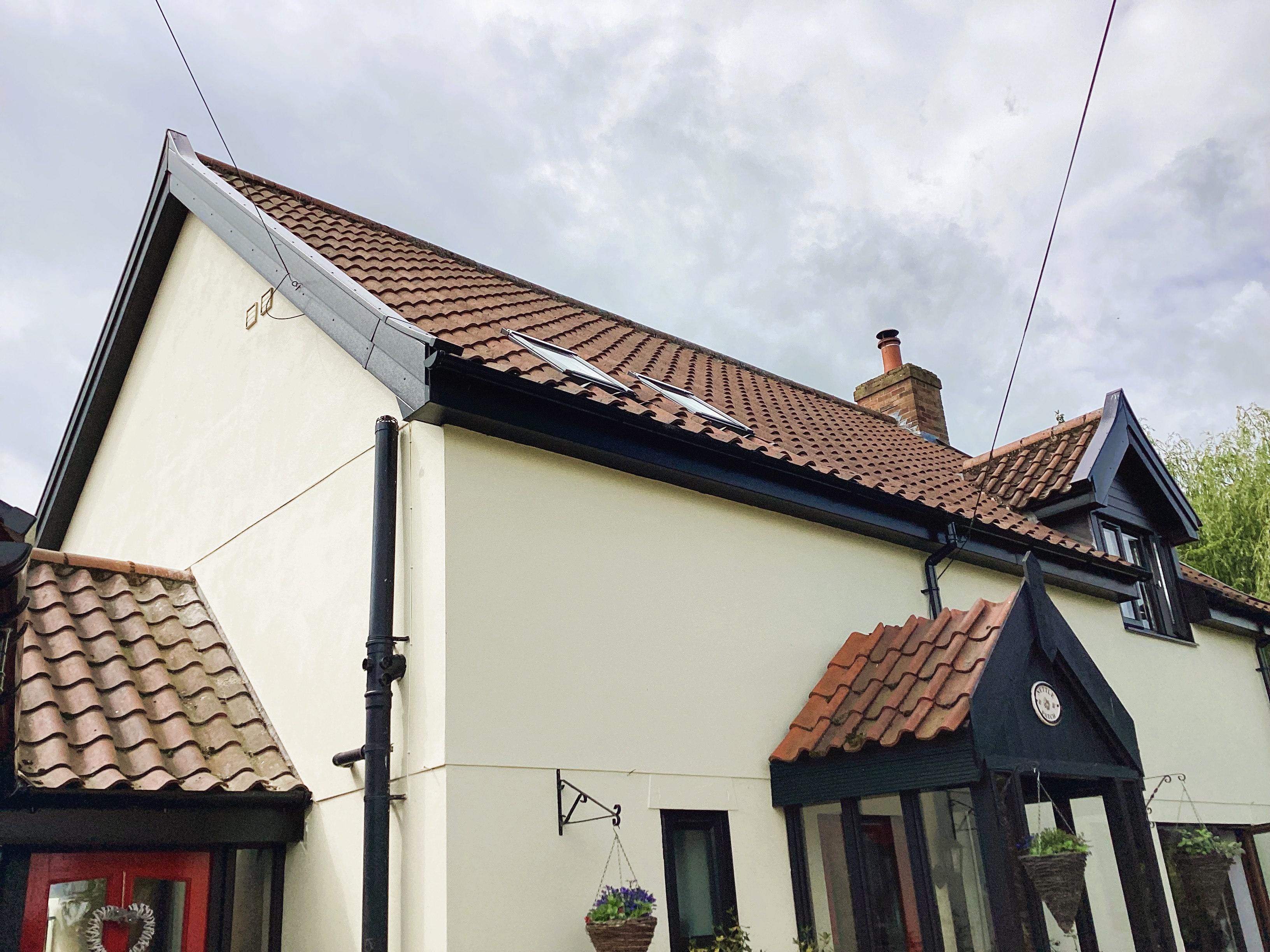 Black uPVC fascias, soffits, guttering and downpipes fitted to a home in Thorndon